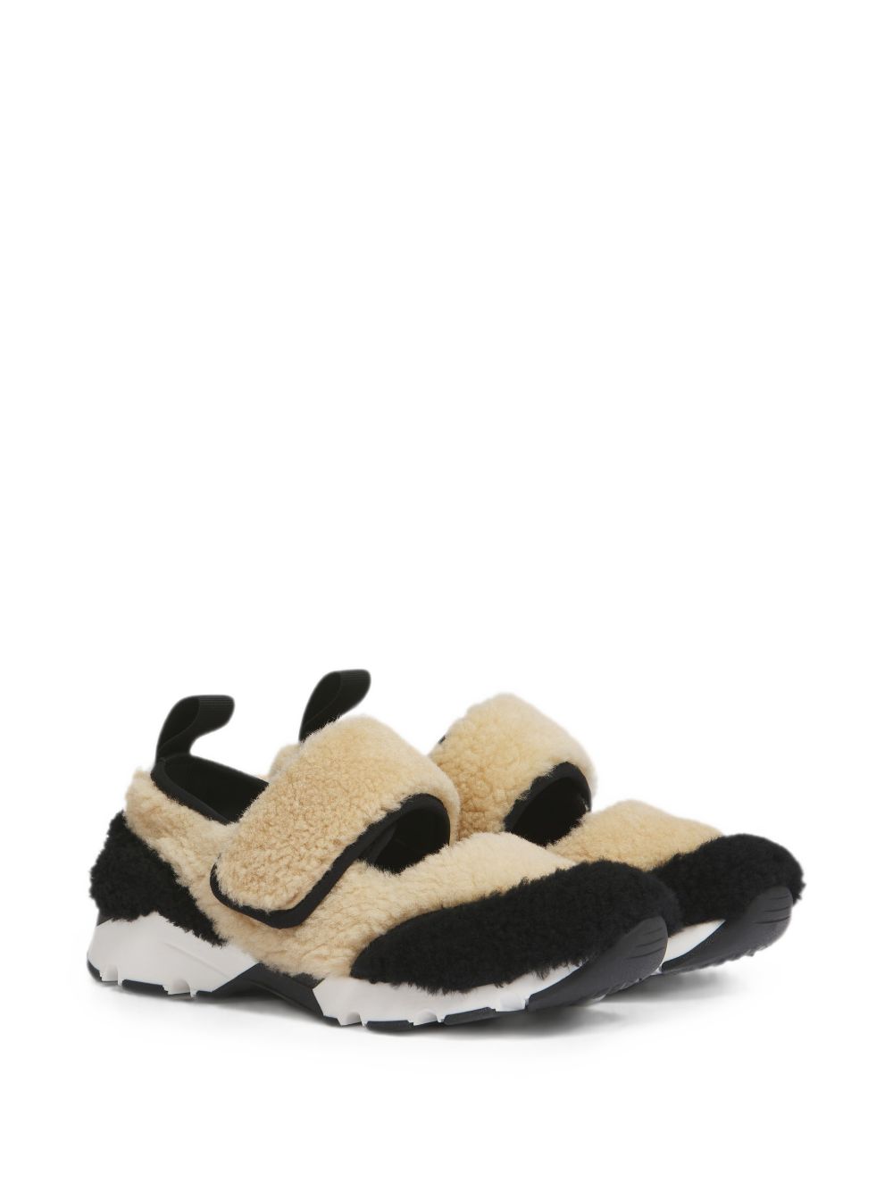 Sneakers in shearling bicolore in beige e nero 
