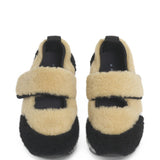 Sneakers in shearling bicolore in beige e nero 