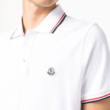 Polo con logo in bianco 