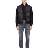 Cardigan trapuntato con zip in nero 