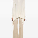 Cardigan con orlo asimmetrico in beige 