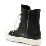 Sneakers alte in pelle in nero 