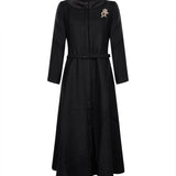 Cappotto bouclé con spilla nero 