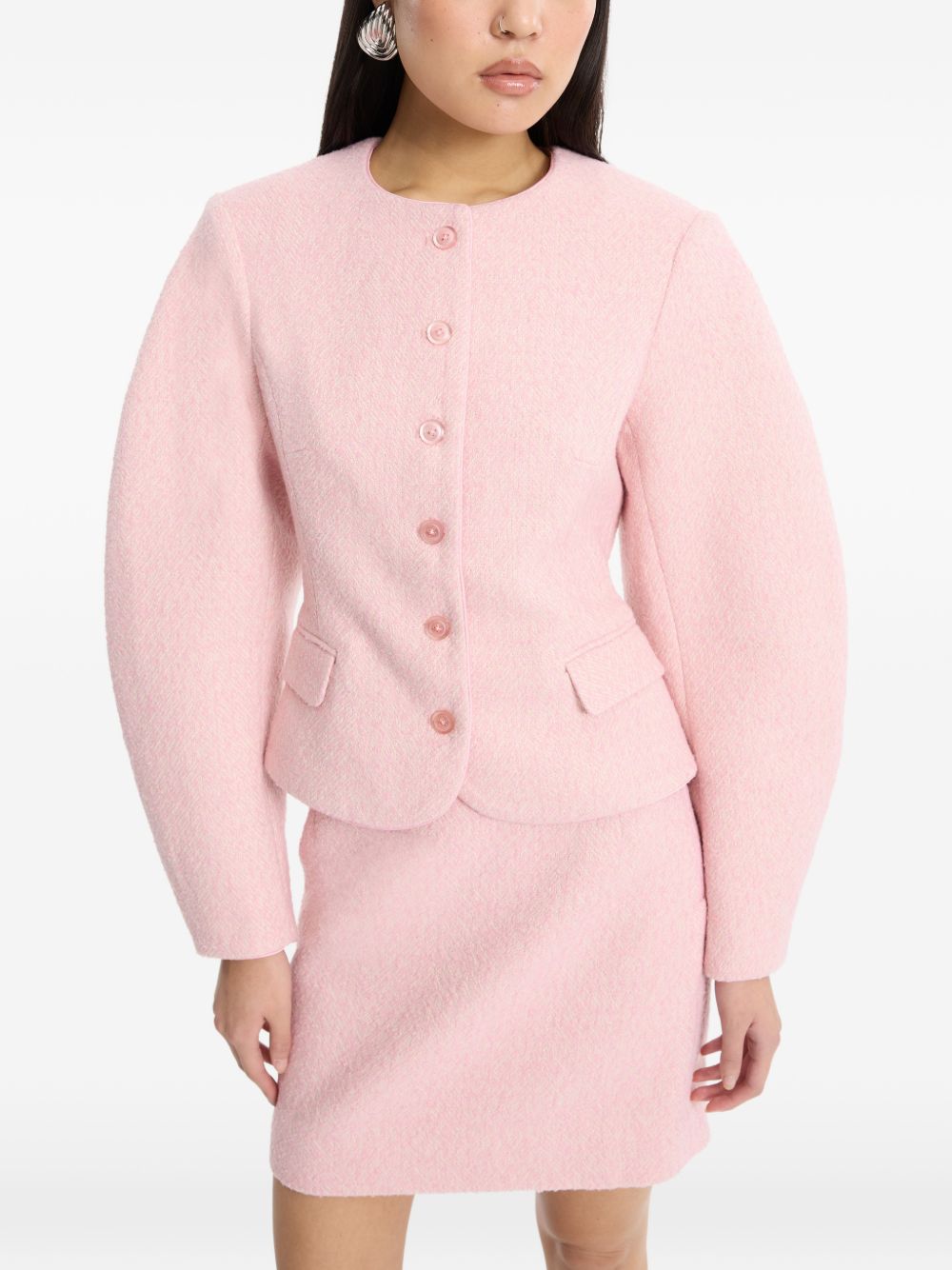 Gonna mini boucle in rosa 