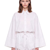 Shorts con orlo in pizzo bianco 