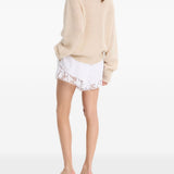 Shorts con orlo in pizzo bianco 