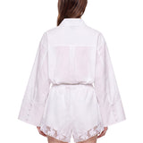 Shorts con orlo in pizzo bianco 