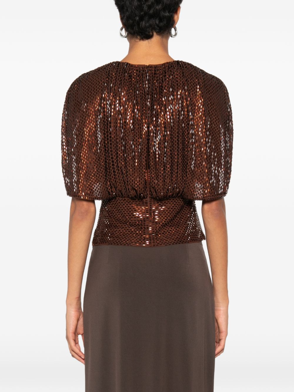 Top arricciato decorato con paillettes 