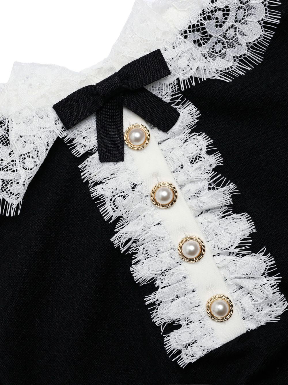 Polo con colletto in pizzo in nero 