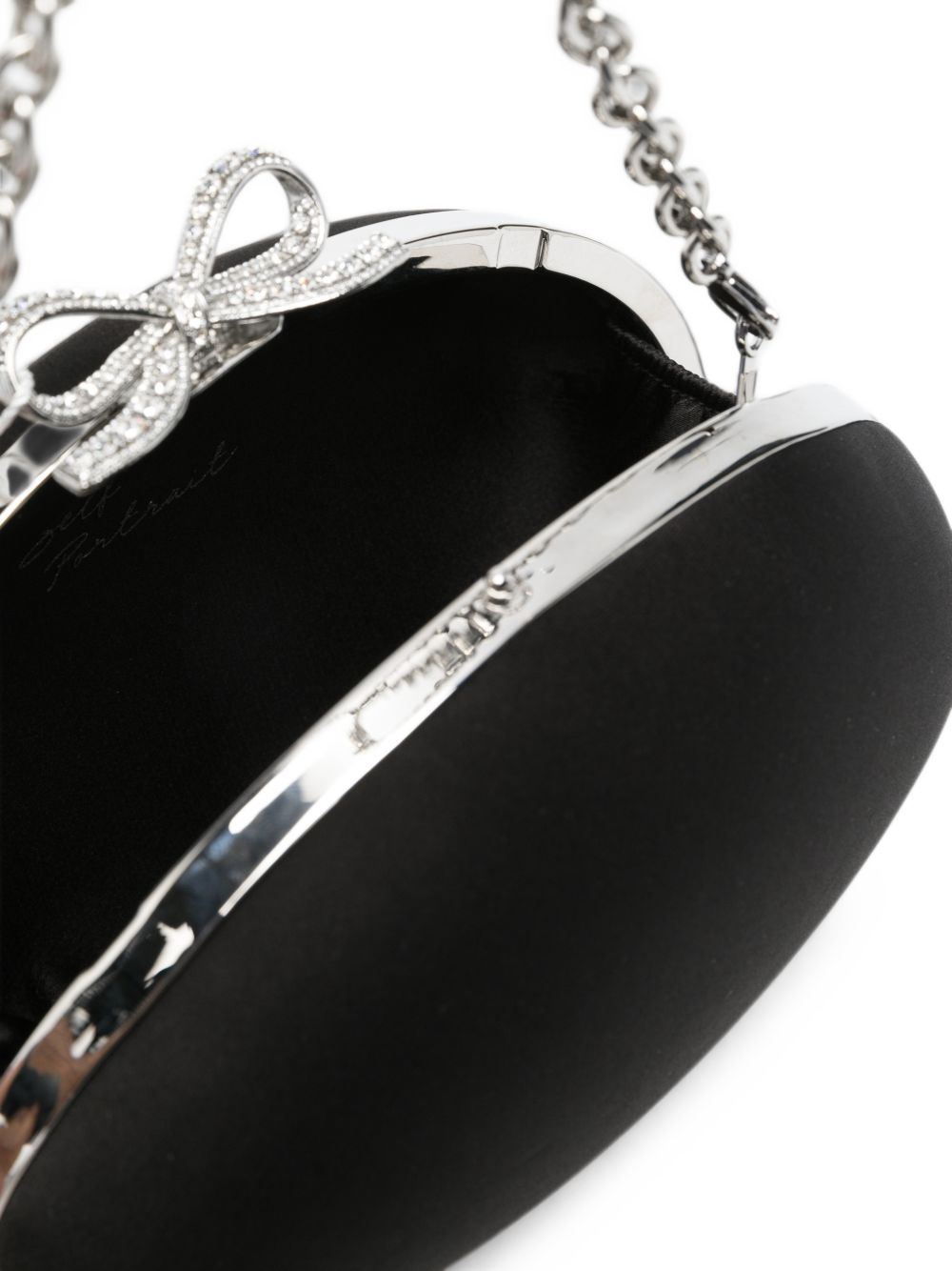 Clutch con chiusura a fermaglio con fiocco in nero 