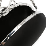 Clutch con chiusura a fermaglio con fiocco in nero 
