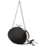 Clutch con chiusura a fermaglio con fiocco in nero 