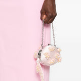 Clutch in raso rosa con decorazioni floreali 
