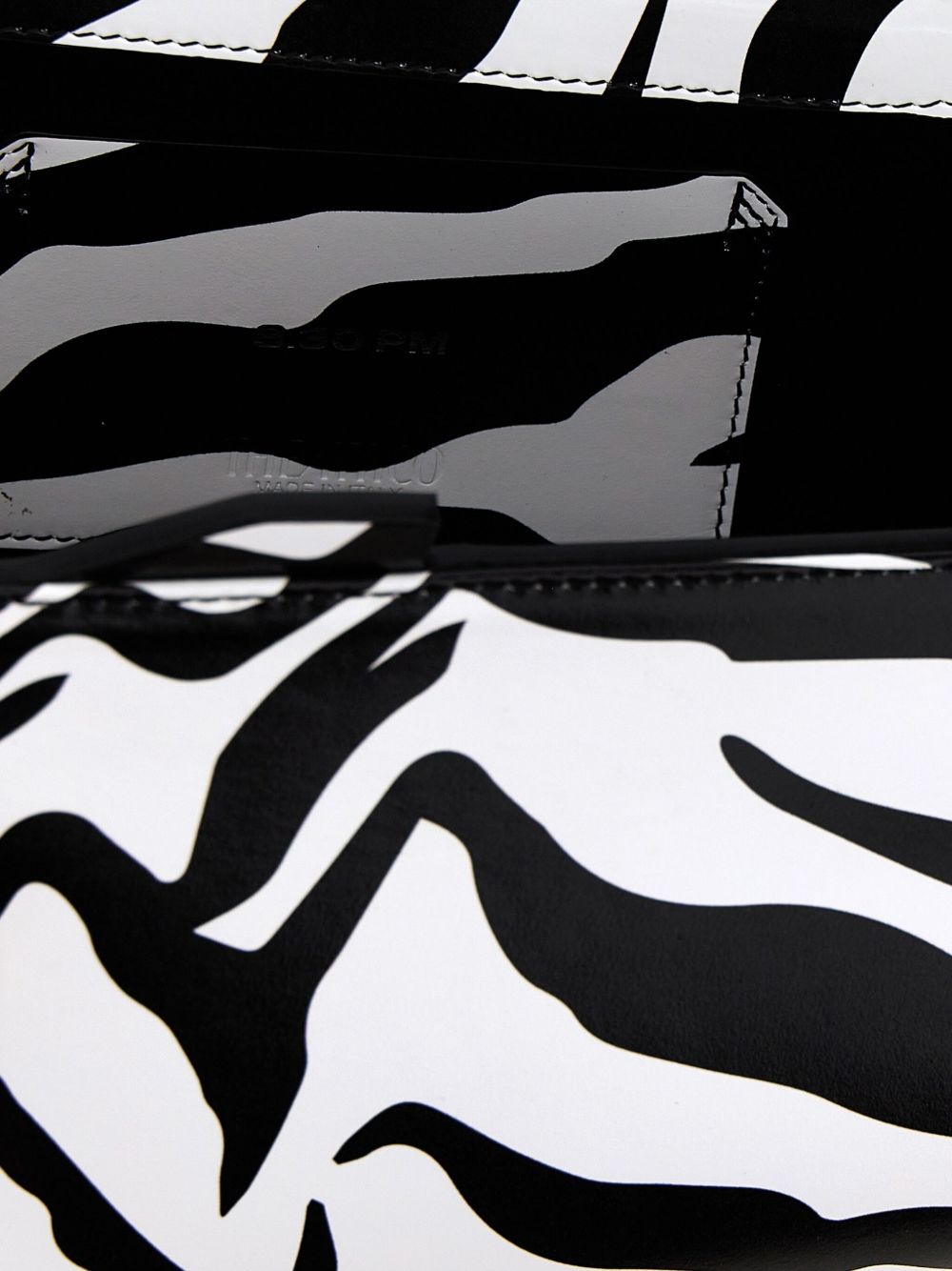 Clutch con stampa zebrata 8.30 pm in nero e bianco 