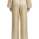 Pantaloni in seta con stampa monogramma in beige 