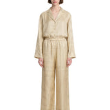 Pantaloni in seta con stampa monogramma in beige 