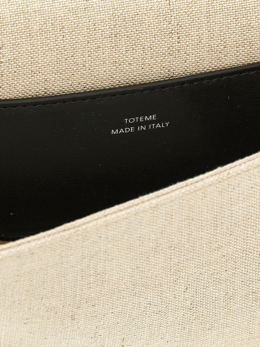 Clutch in tela con falda a T in beige 