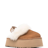 Mules Funkette con cinturino in beige 