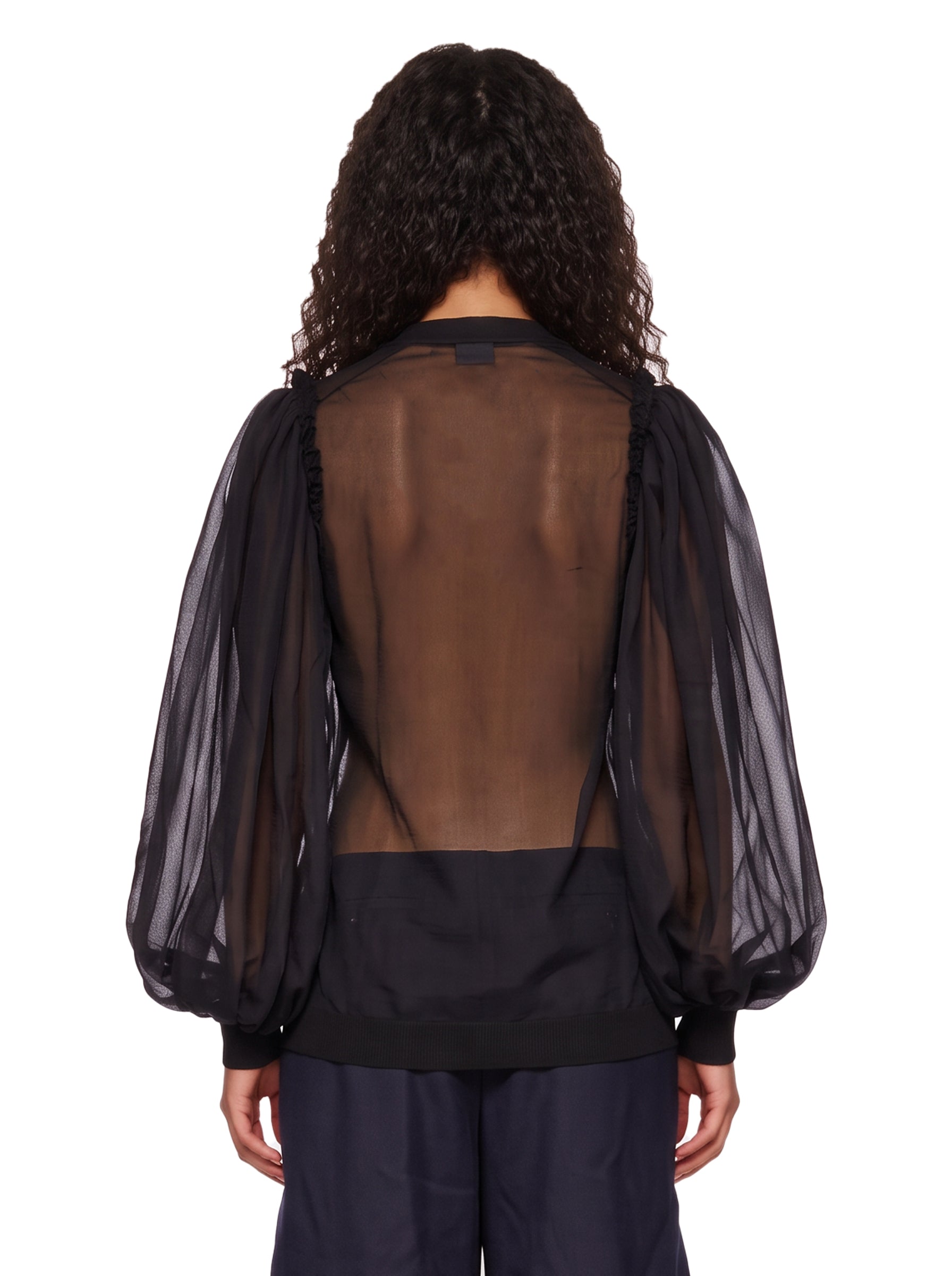 Blusa semitrasparente in tulle in nero 