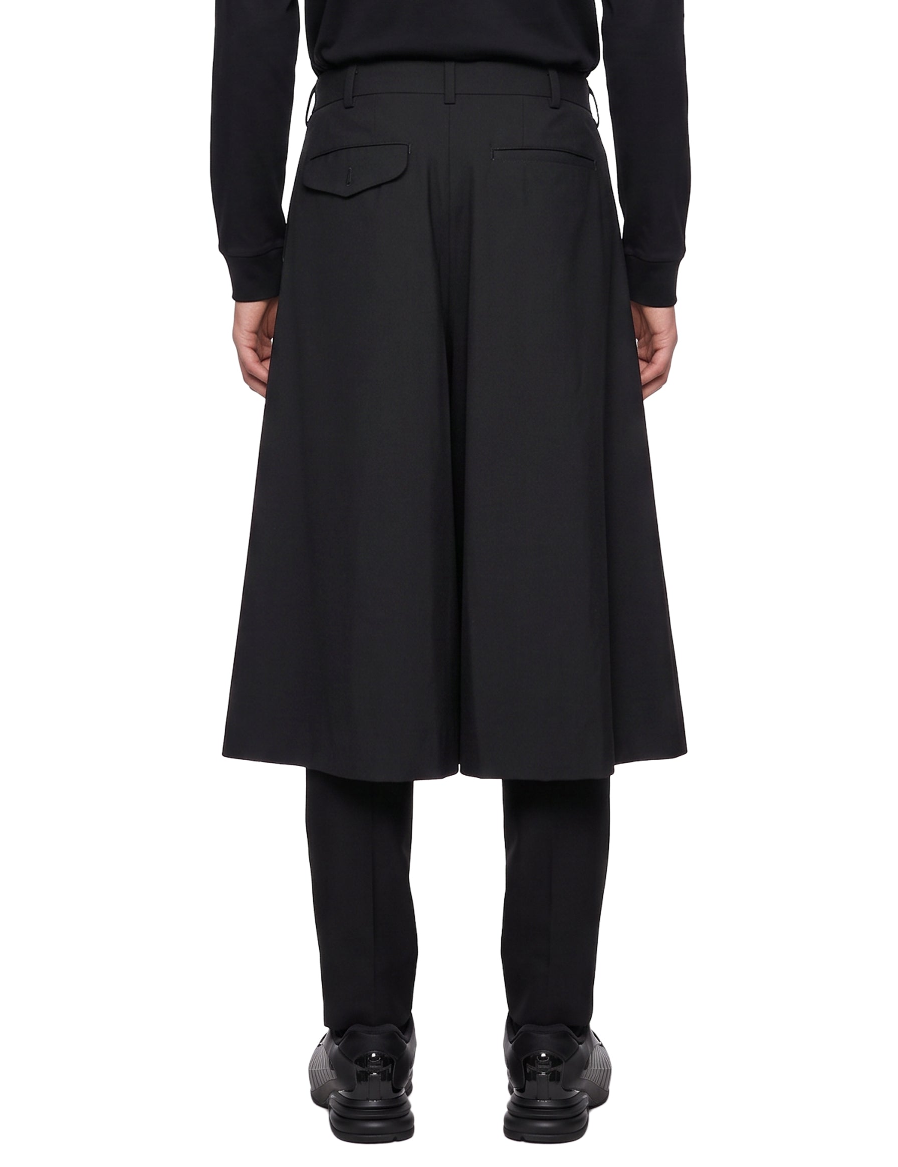 Pantaloni con gonna sovrapposta in nero 