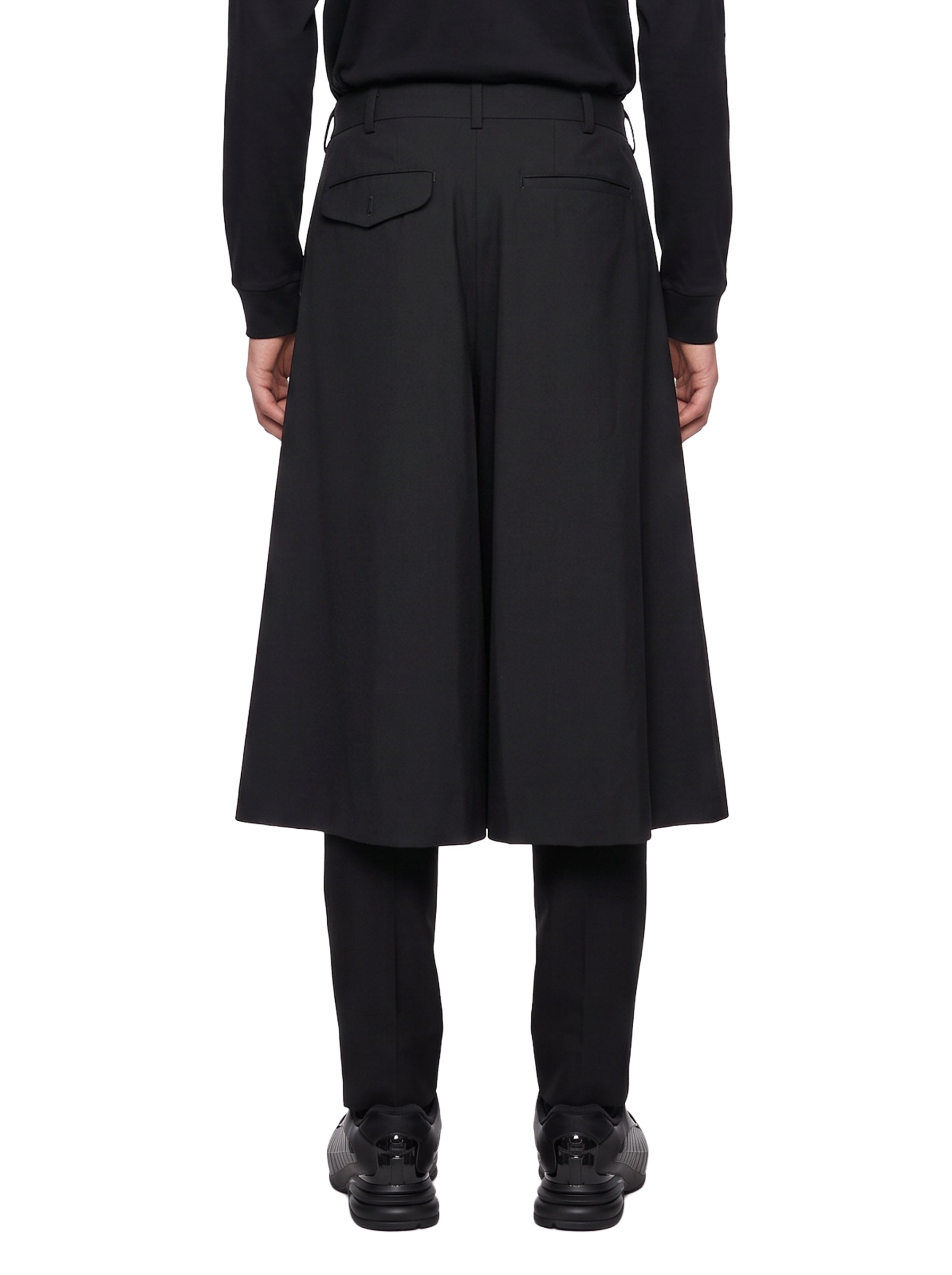 Pantaloni con gonna sovrapposta in nero 