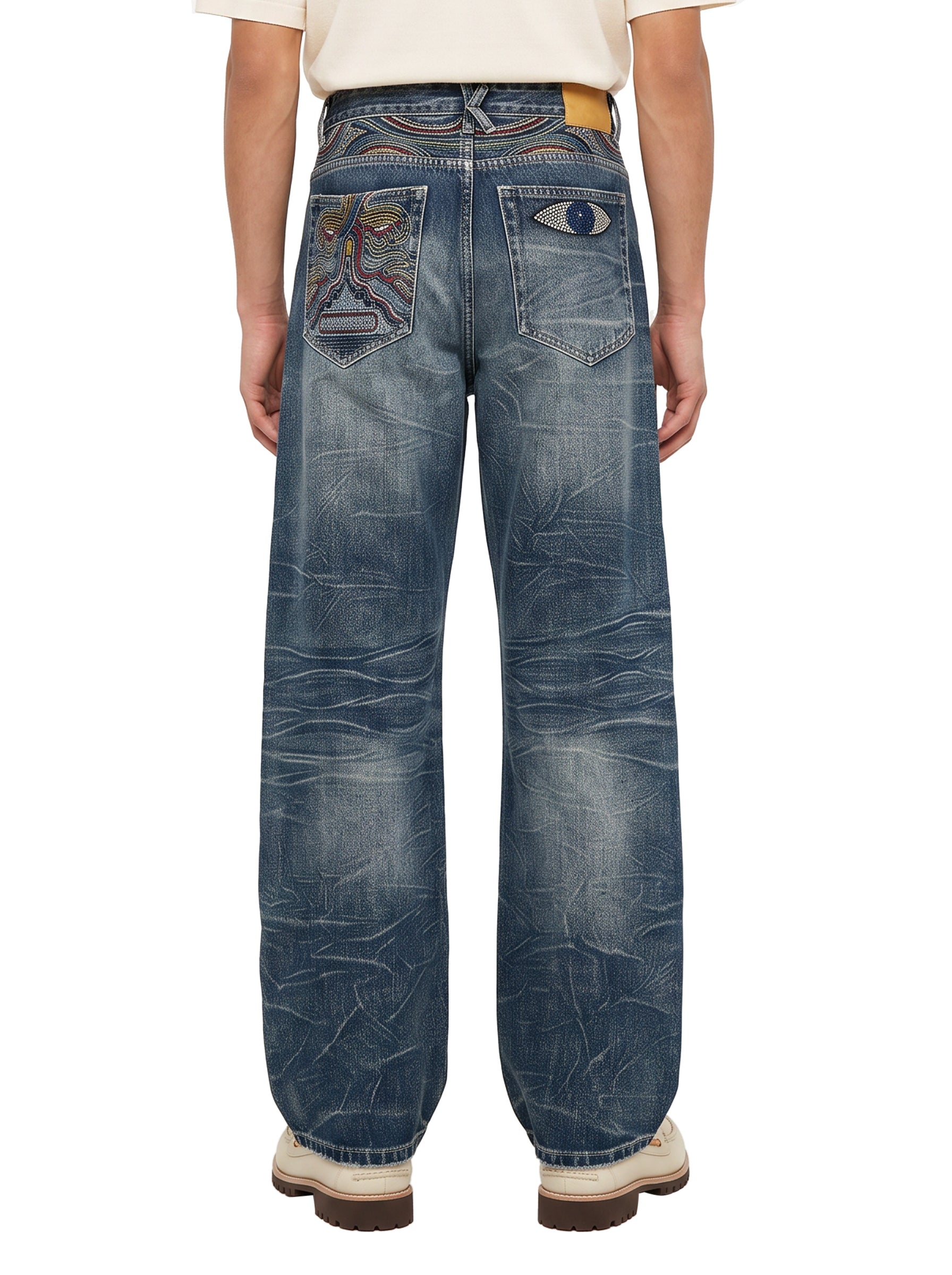 Jeans con ricamo occhio in blu 