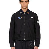 Giacca Coach con patch in nero 