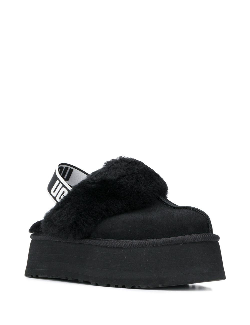 Mules Funkette con cinturino in nero 