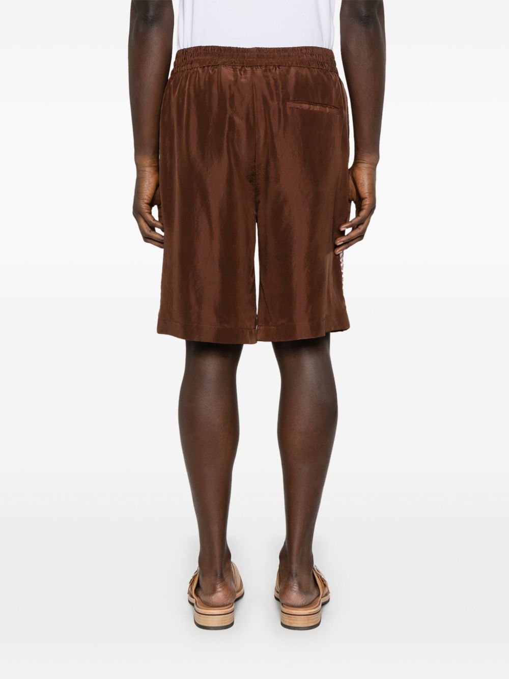 Shorts con stampa grafica in marrone Feng chen wang - uomo 