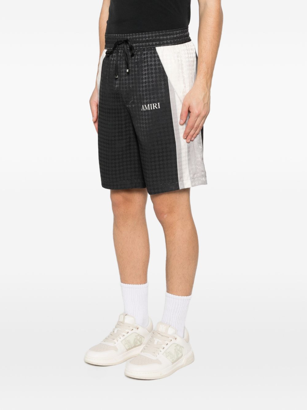 Pantaloncini con coulisse a quadri in nero Amiri - uomo 