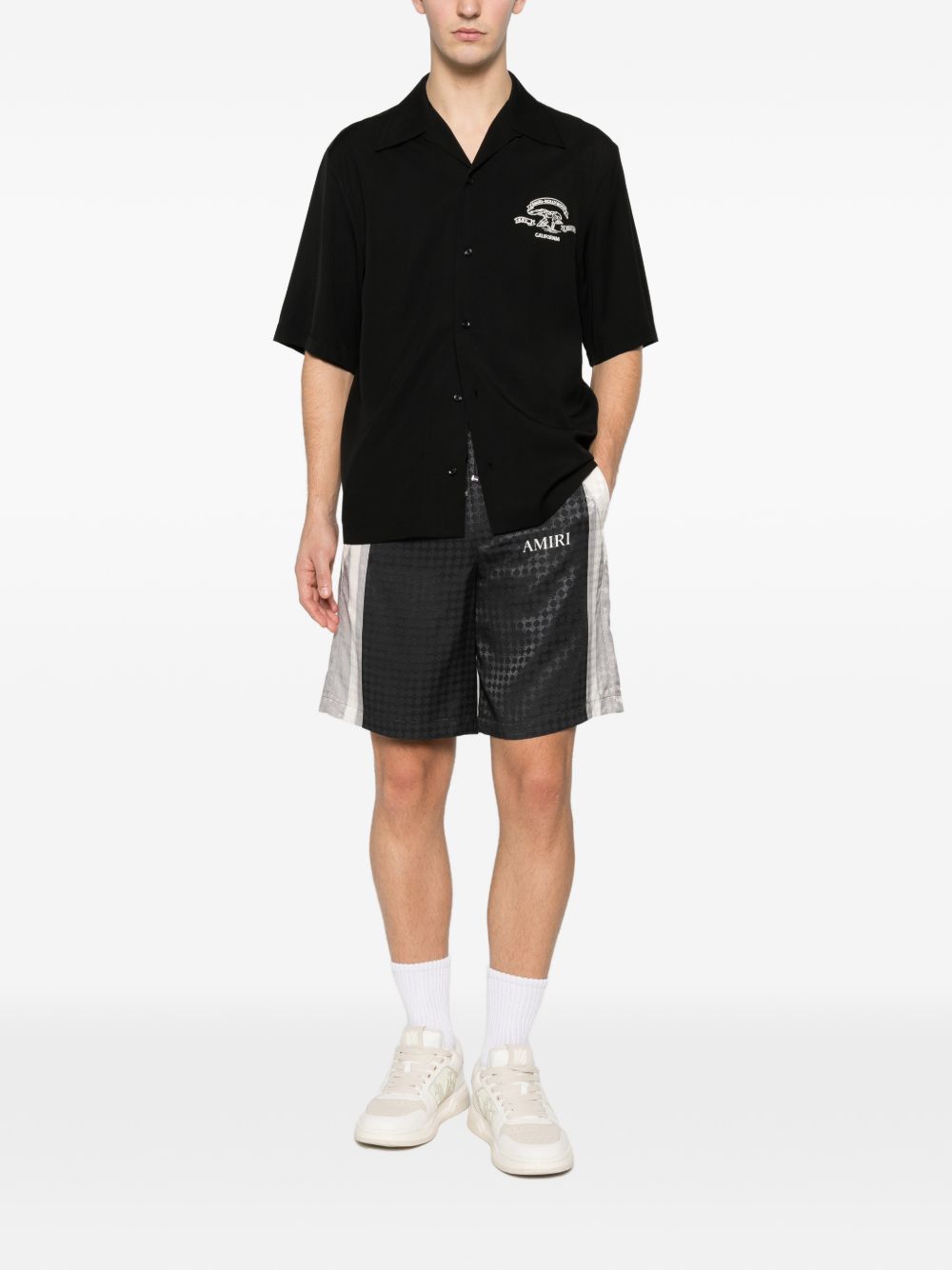 Pantaloncini con coulisse a quadri in nero Amiri - uomo 