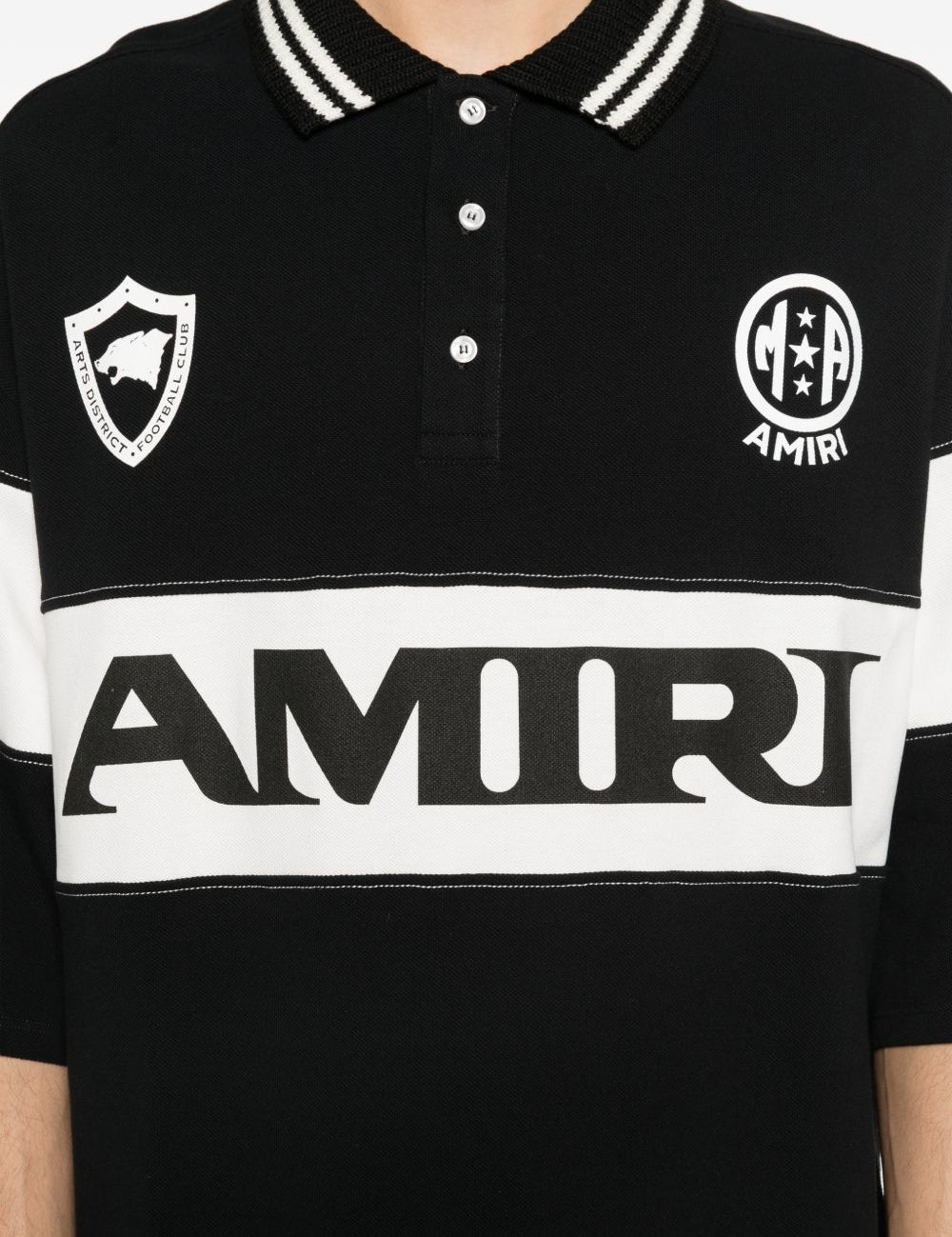 Polo con logo e dettagli a righe in nero e bianco Amiri - uomo 