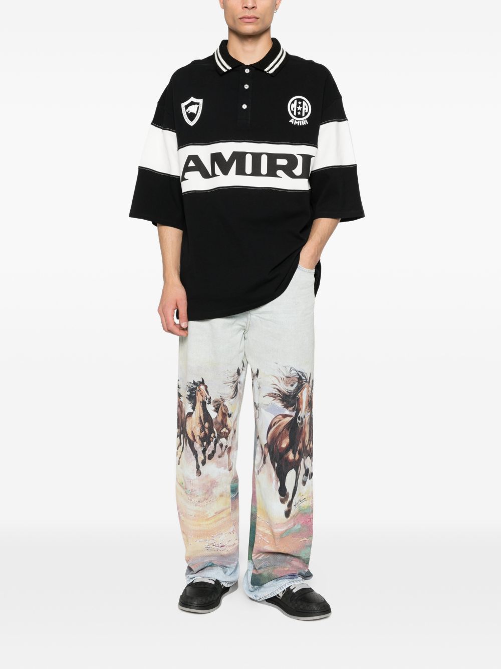 Polo con logo e dettagli a righe in nero e bianco Amiri - uomo 
