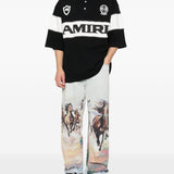 Polo con logo e dettagli a righe in nero e bianco Amiri - uomo 