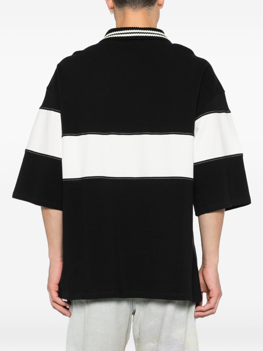 Polo con logo e dettagli a righe in nero e bianco Amiri - uomo 