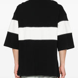 Polo con logo e dettagli a righe in nero e bianco Amiri - uomo 