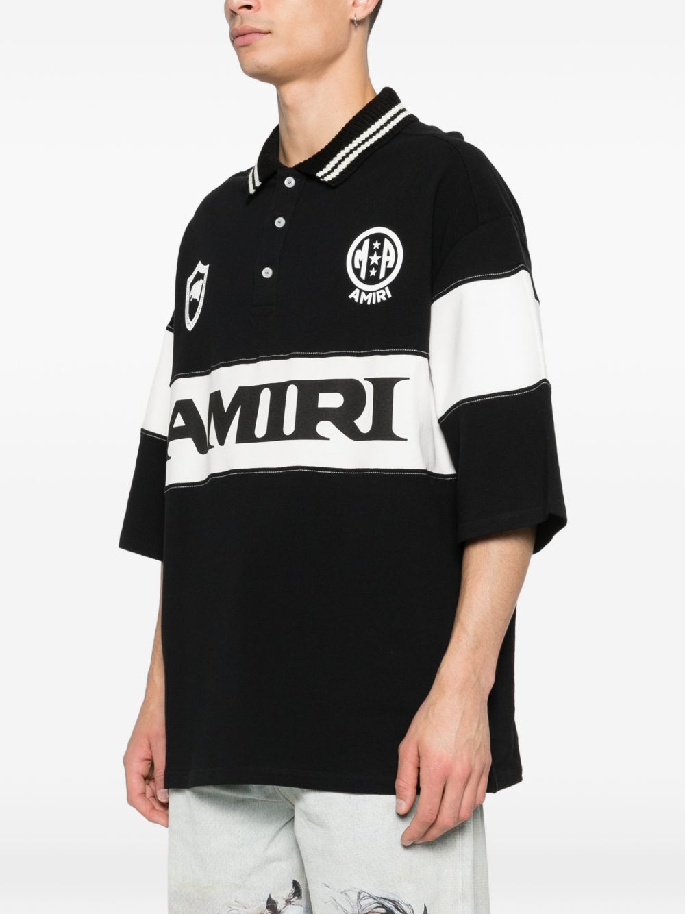 Polo con logo e dettagli a righe in nero e bianco Amiri - uomo 