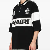 Polo con logo e dettagli a righe in nero e bianco Amiri - uomo 