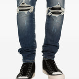 Jeans con strappi in blu Amiri - uomo 