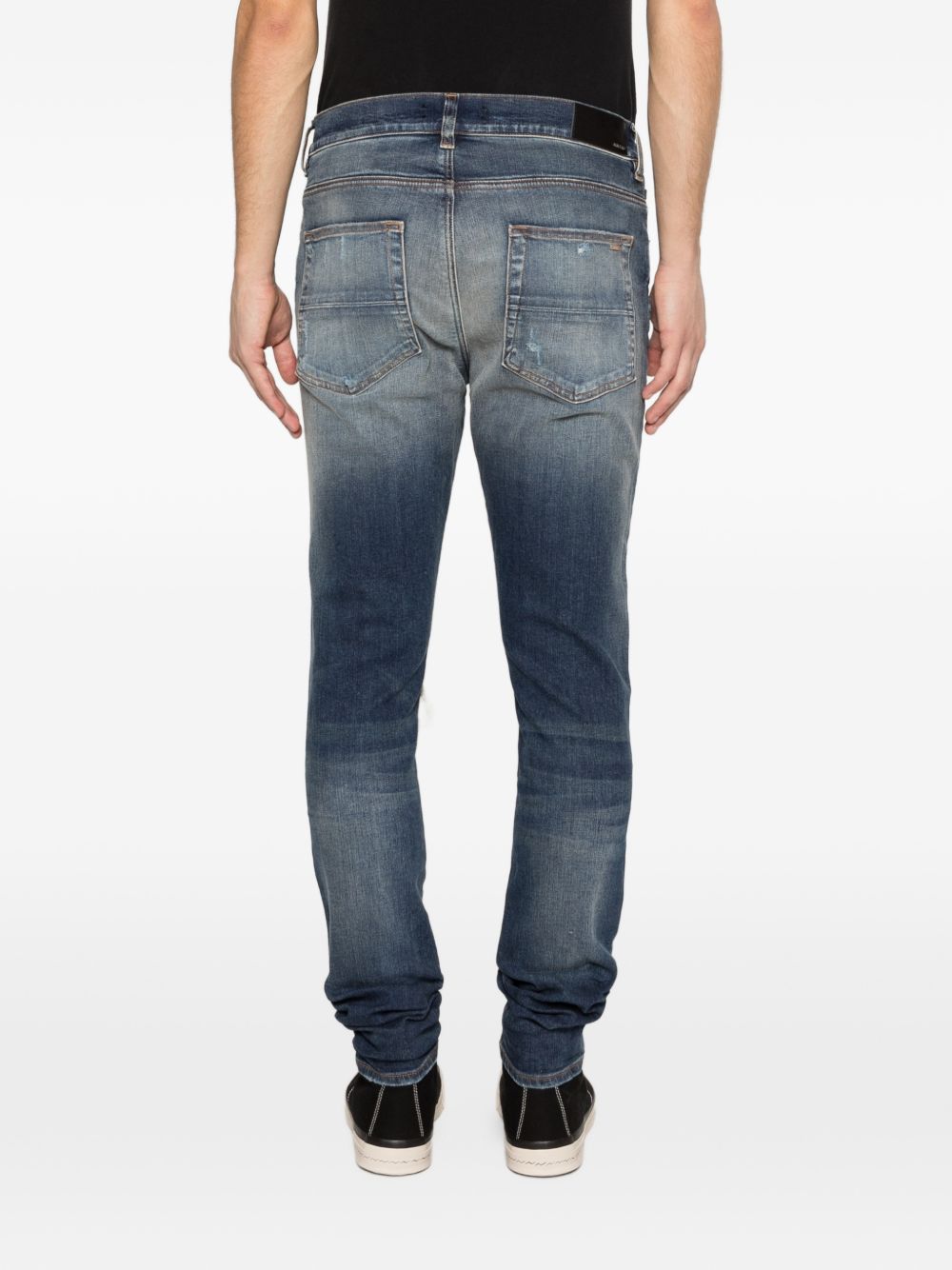 Jeans con strappi in blu Amiri - uomo 