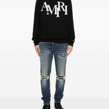 Jeans con strappi in blu Amiri - uomo 
