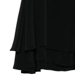 Top con ruchesi in nero 