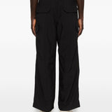 Pantaloni con tasche in nero and Wander - uomo 