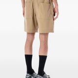 Pantaloncini a pieghe con cintura in beige And wander - uomo 