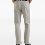 Jeans a cinque tasche con chiusura a bottone in grigio Brunello cucinelli - uomo 