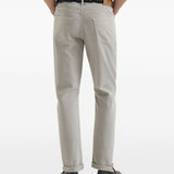 Jeans a cinque tasche con chiusura a bottone in grigio Brunello cucinelli - uomo 
