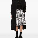 Shorts con stampa Fantasia in nero e bianco Comme des garcons black - unisex 