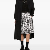 Shorts con stampa Fantasia in nero e bianco Comme des garcons black - unisex 