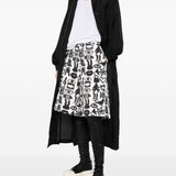 Shorts con stampa Fantasia in nero e bianco Comme des garcons black - unisex 