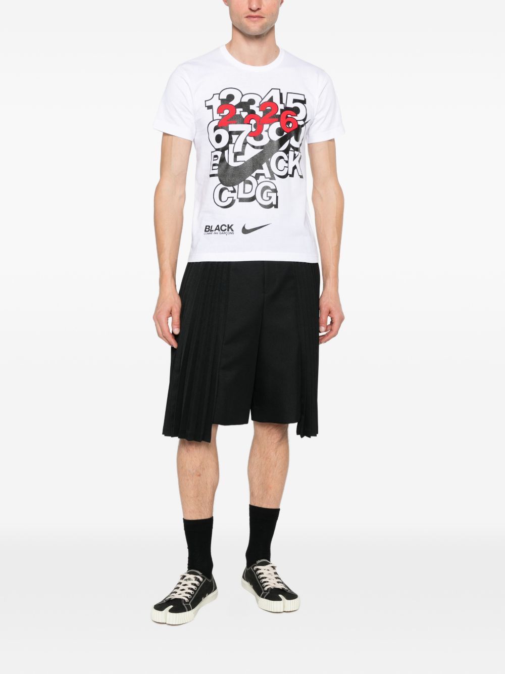 T-shirt con stampa in bianco e nero  Comme Des Garçons Black  x Nike - unisex 